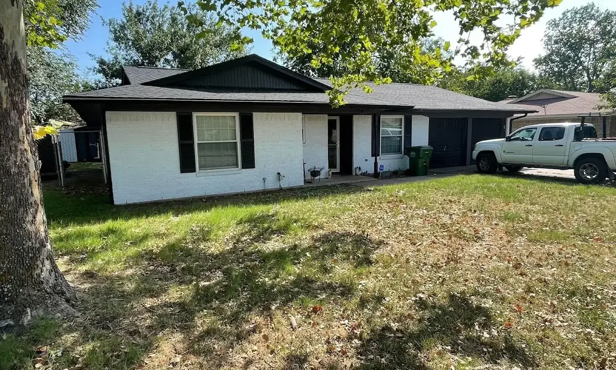 Professional roofing crew working on a residential roof in Lakeville